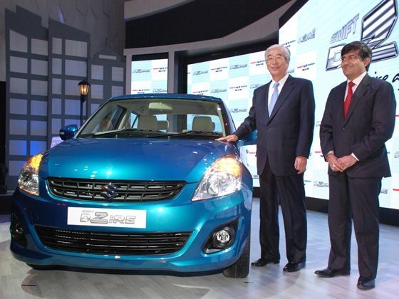 Maruti Suzuki unveils its new Swift DZire in Delhi. Seen with the car are Mr. S Nakanishi MD and Mr. Mayank Pareek MEO (Marketing and Sales)