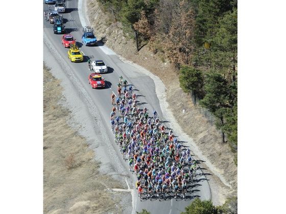 Tour de France a view of the peloton and the convoy from the birds eye view Tour de France a view of the peloton and the convoy from the birds eye view