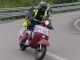Vespas both old and new complete 1000km run in Italy A rider in action at 2013 1000 Km Vespistica