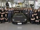 Lamborghini workers pose with the 2,000th Aventador