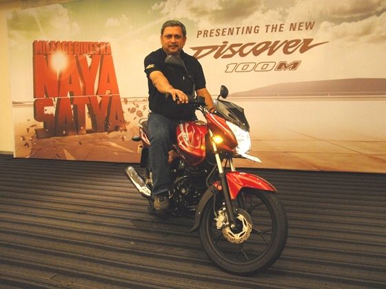 K.Srinivas poses with the Discover 100M at the launch K.Srinivas poses with the Discover 100M at the launch