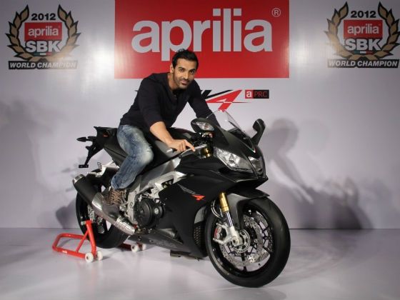 John Abraham poses with the Aprilia RSV4 John Abraham poses with the Aprilia RSV4