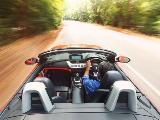 BMW Z4 roof down driving shot BMW Z4 roof down driving shot