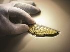 24-carat gold is applied to the signature Aston Martin wing 
