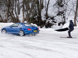 Ski joring champion Franco Moro skiing behind a Bentley Continental GT Ski joring champion Franco Moro skiing behind a Bentley Continental GT