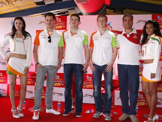 LtoR: Adrian Sutil, Paul di Resta, Nico Hulkenberg and Samar Singh Shekhawat flanked by the Force India girls